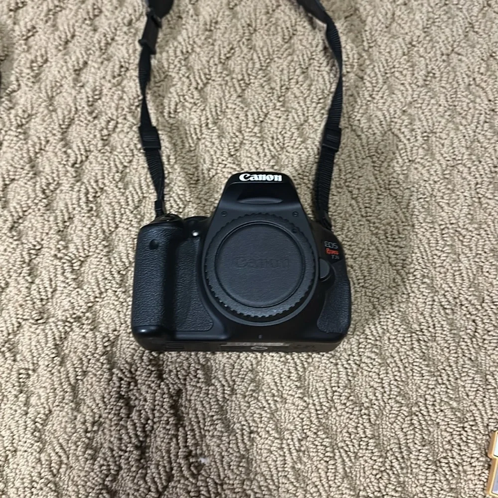 Canon eos rebel t3i with case and two lenses.